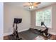 Exercise room featuring a Peloton and a rowing machine with hardwood floors at 7633 Summer Pines Way, Wake Forest, NC 27587