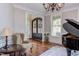 View of the foyer featuring double doors and a grand piano at 7633 Summer Pines Way, Wake Forest, NC 27587