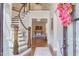 Grand foyer featuring a curved staircase, hardwood floors, and an open view to the formal living area at 7633 Summer Pines Way, Wake Forest, NC 27587