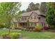 A stunning stone and shingle home with lush landscaping, perfect for curb appeal at 7633 Summer Pines Way, Wake Forest, NC 27587