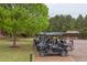 Golf carts parked in front of lush greenery, offering convenient access to the golf course at 7633 Summer Pines Way, Wake Forest, NC 27587