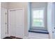 Bright hallway with built in window seat, closet and wood floors at 7633 Summer Pines Way, Wake Forest, NC 27587