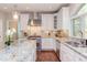 Gourmet kitchen with granite countertops, stainless steel appliances, and custom cabinetry at 7633 Summer Pines Way, Wake Forest, NC 27587