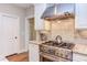 Modern kitchen features stainless steel appliances, tile backsplash, and granite countertops at 7633 Summer Pines Way, Wake Forest, NC 27587