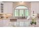 Spacious kitchen featuring granite countertops, custom cabinets, and stainless steel appliances at 7633 Summer Pines Way, Wake Forest, NC 27587
