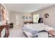Living room featuring a large comfortable couch, game table, and natural light from a window at 7633 Summer Pines Way, Wake Forest, NC 27587