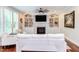 Comfortable living room with built-in bookshelves, fireplace, and a ceiling fan at 7633 Summer Pines Way, Wake Forest, NC 27587