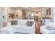 Bright open-concept living room with a glimpse of kitchen and stairway at 7633 Summer Pines Way, Wake Forest, NC 27587