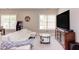 Bright living room features a large white couch, entertainment center, and game console at 7633 Summer Pines Way, Wake Forest, NC 27587