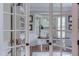 Elegant home office with a bay window, custom built-ins, and plenty of natural light, ideal for productivity at 7633 Summer Pines Way, Wake Forest, NC 27587