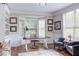 Sophisticated home office featuring a bay window, custom bookshelves, and elegant decor for a productive workspace at 7633 Summer Pines Way, Wake Forest, NC 27587