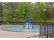 Community splash pad with colorful play structures, perfect for young outdoor water fun at 7633 Summer Pines Way, Wake Forest, NC 27587