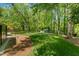 A well maintained lawn and mature trees create a private backyard oasis at 7653 Summerglen Dr, Raleigh, NC 27615