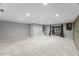 Spacious carpeted basement with recessed lights and walk-out at 7653 Summerglen Dr, Raleigh, NC 27615