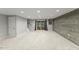 Finished basement with carpet, recessed lights, wood plank accent wall, and sliding glass doors at 7653 Summerglen Dr, Raleigh, NC 27615