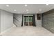 Finished basement with a walkout and plank accent wall at 7653 Summerglen Dr, Raleigh, NC 27615