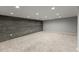 Finished basement with carpet, recessed lights, and an accent wall featuring horizontal wood planks at 7653 Summerglen Dr, Raleigh, NC 27615