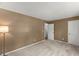 Bedroom featuring two closets, neutral carpet, and neutral colored walls at 7653 Summerglen Dr, Raleigh, NC 27615