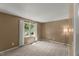 Bedroom featuring a window with curtains, neutral carpet, and view to backyard at 7653 Summerglen Dr, Raleigh, NC 27615