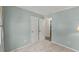 Neutral-toned bedroom featuring two closets and view to another room at 7653 Summerglen Dr, Raleigh, NC 27615