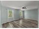Serene bedroom featuring neutral paint, hardwood floors, and lots of natural light at 7653 Summerglen Dr, Raleigh, NC 27615