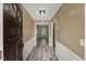 Inviting foyer with modern flooring, white molding, and a view into the home at 7653 Summerglen Dr, Raleigh, NC 27615