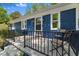Welcoming porch, with table and chairs, offers a relaxing spot to enjoy the outdoors at 7653 Summerglen Dr, Raleigh, NC 27615