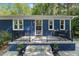 Cozy front porch with seating and charming curb appeal at 7653 Summerglen Dr, Raleigh, NC 27615