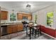 Charming kitchen with stainless steel appliances, light wood cabinets, and granite countertops at 7653 Summerglen Dr, Raleigh, NC 27615