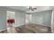 Spacious open-concept living room featuring bright neutral paint and wood flooring at 7653 Summerglen Dr, Raleigh, NC 27615