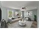 Inviting living room with modern decor, ample seating, and bright natural light at 7653 Summerglen Dr, Raleigh, NC 27615