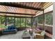 Enclosed patio with comfortable seating, perfect for relaxing at 7653 Summerglen Dr, Raleigh, NC 27615