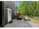 Rear patio with outdoor seating and well maintained lawn at 7653 Summerglen Dr, Raleigh, NC 27615