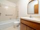 Bathroom with a shower and tub, along with ample counter space and storage at 7716 Bluff Top Court Ct, Raleigh, NC 27615