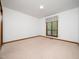 Bedroom featuring neutral carpet and a window that provides natural light at 7716 Bluff Top Court Ct, Raleigh, NC 27615