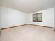 A simple bedroom with neutral carpet and a window for natural light at 7716 Bluff Top Court Ct, Raleigh, NC 27615