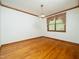 Bright dining area featuring hardwood floors and a window with decorative curtains at 7716 Bluff Top Court Ct, Raleigh, NC 27615