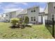 Beautiful backyard featuring lush lawn, fountain, privacy fence, and patio, perfect for outdoor entertaining and relaxation at 7728 Cape Charles Dr, Raleigh, NC 27617