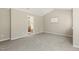 Spacious bedroom with neutral carpet and bathroom access at 7728 Cape Charles Dr, Raleigh, NC 27617