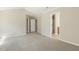 Bedroom with neutral carpet and multiple doorways at 7728 Cape Charles Dr, Raleigh, NC 27617