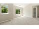 Neutral bedroom with carpet, natural light, and closet at 7728 Cape Charles Dr, Raleigh, NC 27617