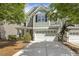 Inviting home with a spacious two-car garage and a well-maintained front yard at 7728 Cape Charles Dr, Raleigh, NC 27617