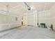 Clean two-car garage with ample space and interior pedestrian door to inside the home, perfect for storage and vehicles at 7728 Cape Charles Dr, Raleigh, NC 27617