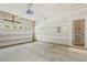 Spacious two-car garage with automatic door, clean floors, and room for storage and a pedestrian door to the interior at 7728 Cape Charles Dr, Raleigh, NC 27617
