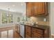 Kitchen area features granite countertops, stainless steel appliances, and views of the backyard at 7728 Cape Charles Dr, Raleigh, NC 27617