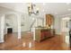 Open concept kitchen with granite counters and views of the surrounding living spaces at 7728 Cape Charles Dr, Raleigh, NC 27617