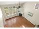Aerial view of living room with hardwood floors, fireplace and backyard view at 7728 Cape Charles Dr, Raleigh, NC 27617