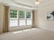 Neutral bedroom featuring large windows and plush carpeting at 792 Eldridge Loop, Cary, NC 27519