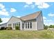 Exterior elevation features white siding, and an adjacent well-kept lawn at 792 Eldridge Loop, Cary, NC 27519