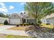 Charming single-Gathering home featuring a manicured front yard and attached two-car garage at 792 Eldridge Loop, Cary, NC 27519